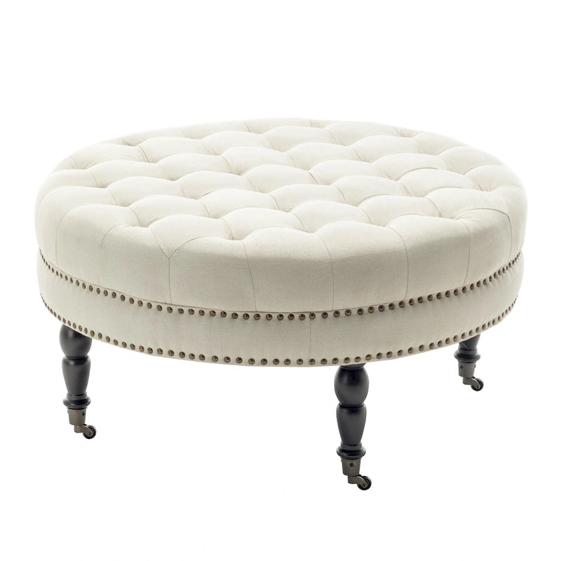 Ottoman de cocktail rond touffeté en tissu avec pieds et roulettes en bois d'hévéa