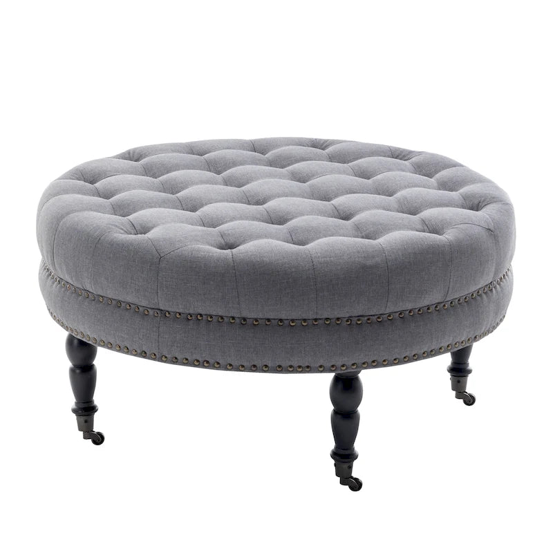 Ottoman de cocktail rond touffeté en tissu avec pieds et roulettes en bois d'hévéa